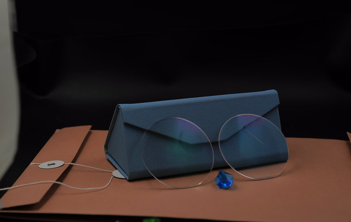 Bifocal blue cut lens sample with visible segment and AR coating reflection