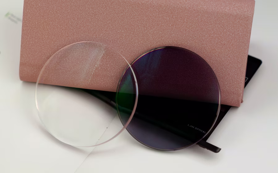 Blue cut photochromic progressive lenses with light adaptive tint