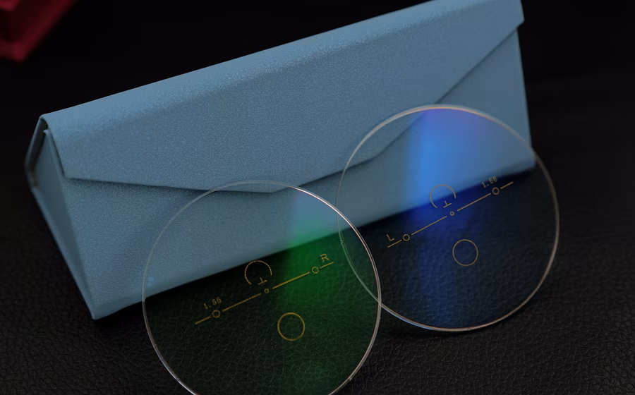 Blue cut progressive marked lenses with blue and green coating reflections
