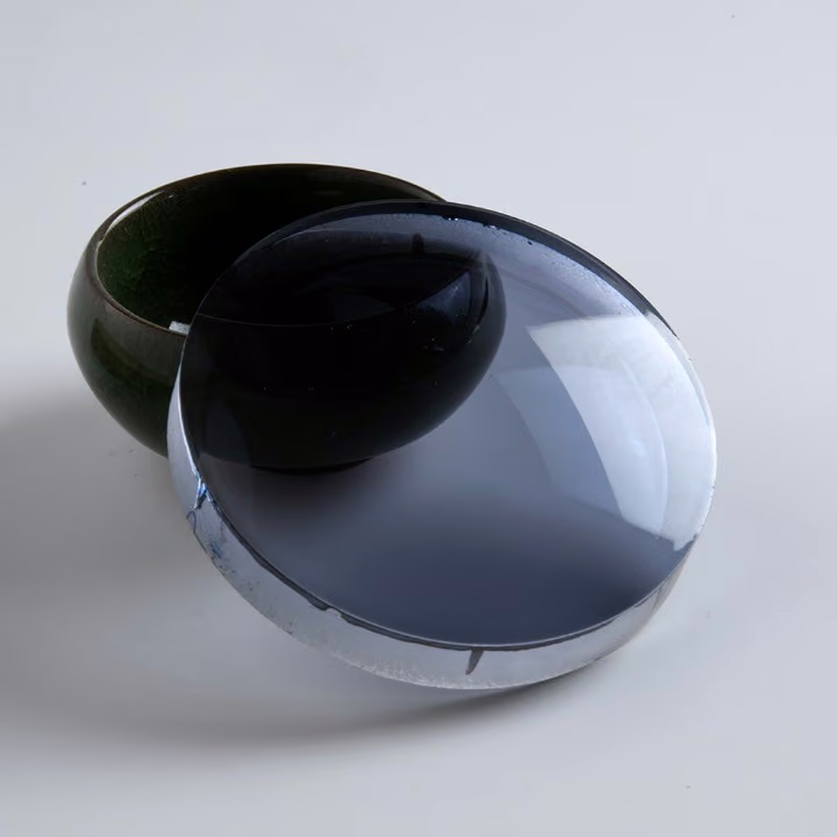 Semi-finished photochromic lens blanks with light-adaptive tint